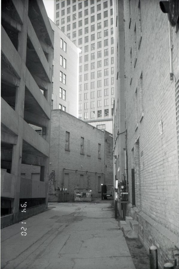 Alley, parking structure, black and white 35mm film.
