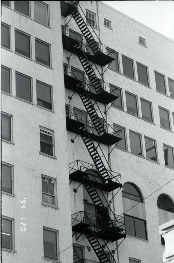 Fire escape, black and white 35mm film.